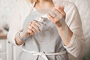 The girl squeezes strawberry marshmallows out of a pastry bag. Handmade desserts, home cooking, sweets cover