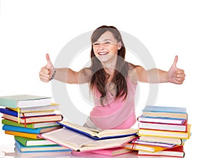 Girl with stack book showing thumb up.