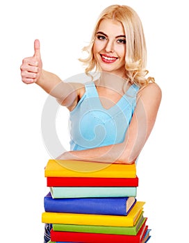 Girl with stack book showing thumb up.