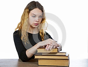 Girl with a stack of books isolated on a white