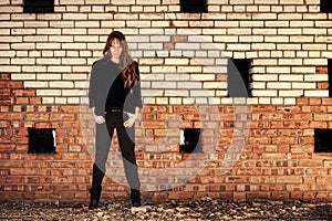 Girl stand near wall