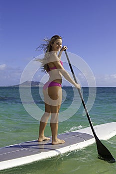 Girl on stand up paddle board