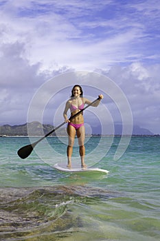 Girl on stand up paddle board