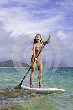 Girl on stand up paddle board