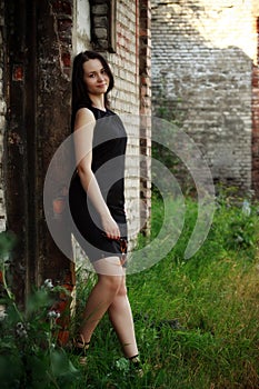 Girl standing amongst ruins