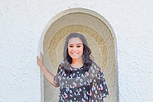 Girl Standing in Arched Doorway