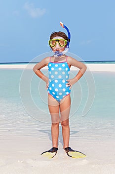 Girl Standing On Beach Wearing Snorkel And Flippers