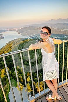 Girl standing on deck of Pyramidenkogel viewing tower in Carinthia