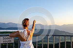 Girl standing on deck of Pyramidenkogel viewing tower in Carinthia