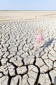 Girl standing on dry land