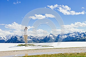 Girl standing on edge of Schafberg mountain, Austria