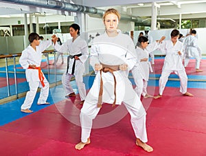 Girl standing in fighting stance during karate training