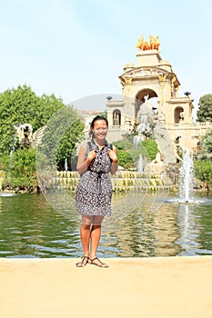 Girl standing in front of Cascada Monumental in Barcelona