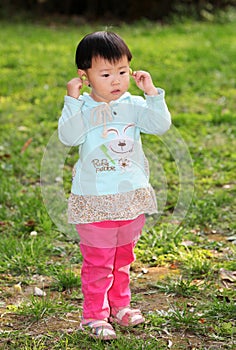 Girl standing on grass