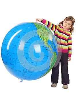 Girl standing and holding big inflatable globe