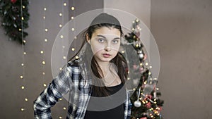 Girl standing near the christmas tree