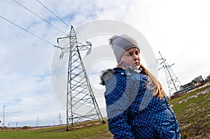 Girl standing near a pylon, bad influence on people concept