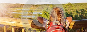 Girl standing on the observation tower on the Viru bog.