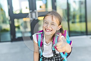 Girl Standing Outside School With Bag