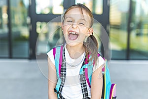 Girl Standing Outside School With Bag