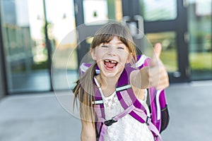 Girl Standing Outside School With Bag