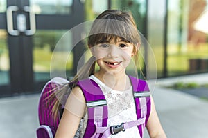 Girl Standing Outside School With Bag