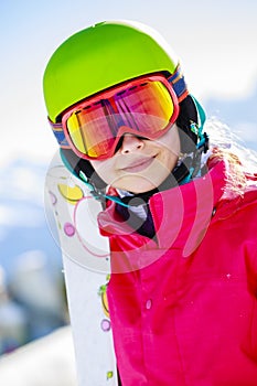 Girl standing portrait on the fresh powder snow.