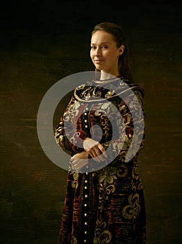 Girl standing in Russian traditional costume.
