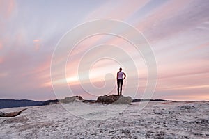 Girl stands awestruck admiring the Blue Mountains Sunset