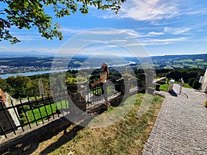 girl stands with his back to the camera. against the background of a beautiful landscape photo