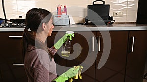 The girl started cleaning the kitchen