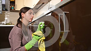 The girl started cleaning the kitchen