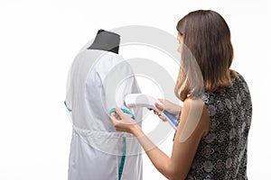 Girl steals a medical gown isolated on a white background