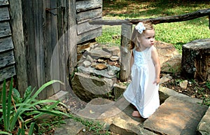 Girl on steps of Cabin