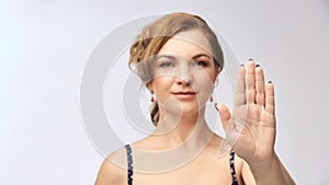 Girl stop hand gesture. Serious people face. Abuse portrait. Forbidden female sign. Don`t angry expression photo