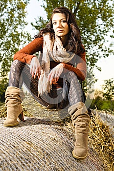 Girl on straw bales