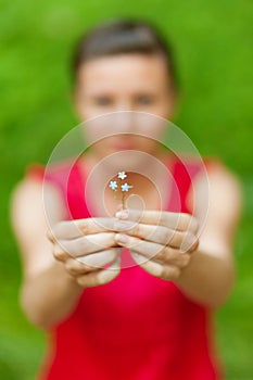 Girl stretches flower