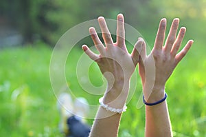 Girl stretches her hands