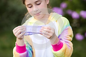 Girl stretches slime. child plays