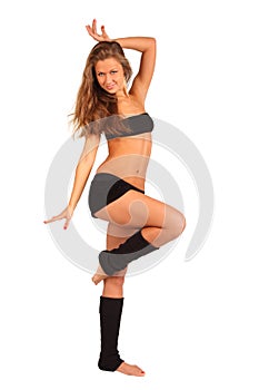 Girl strikes graceful pose isolated