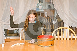 Girl stringing popcorn photo