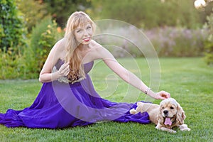 Girl stroking a dog.