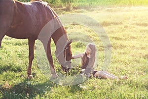 Girl stroking her horse