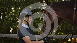 Girl stroking her horse slow motion