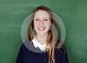 A girl student with blackboard photo