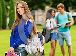 Girl student in a city park