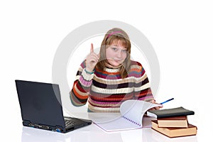 Girl student doing schoolwork photo