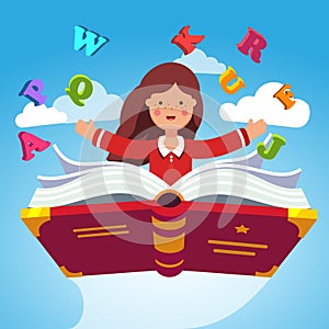 Girl student flying on a magical primer ABC book