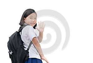 Girl student going to school and waving goodbye