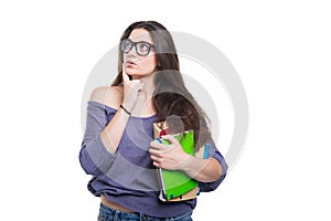 Girl student holding a book in her hand thinking